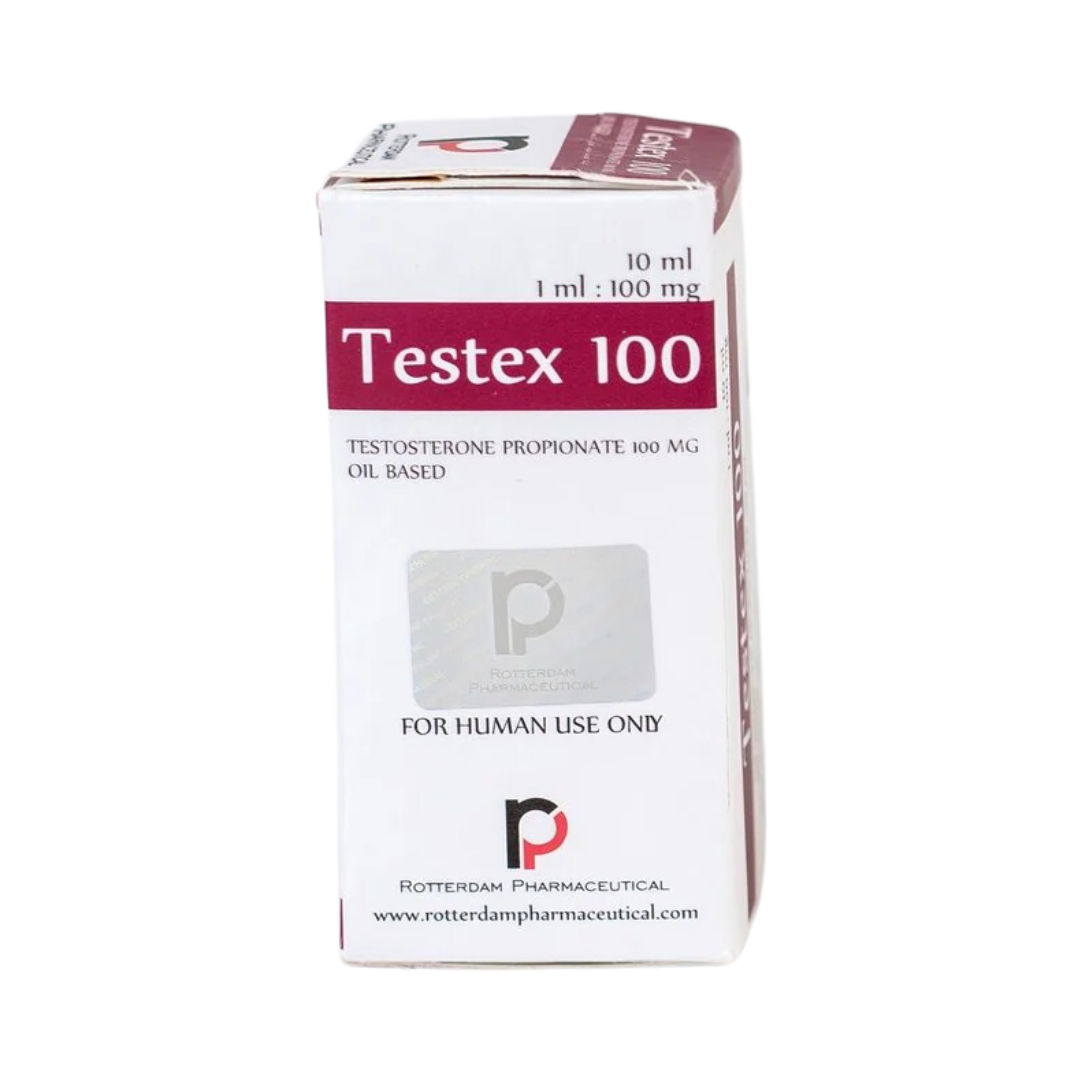 Una caja blanca con la etiqueta Testex 100 - ROTTERDAM con detalles en color granate contiene un vial de 10 ml de propionato de testosterona, base de aceite. Dice SOLO PARA USO HUMANO y 1 ml: 100 mg. El logotipo y el sello de Rotterdam Pharmaceutical se muestran de forma destacada en la parte inferior. Marca: Get Fit México.