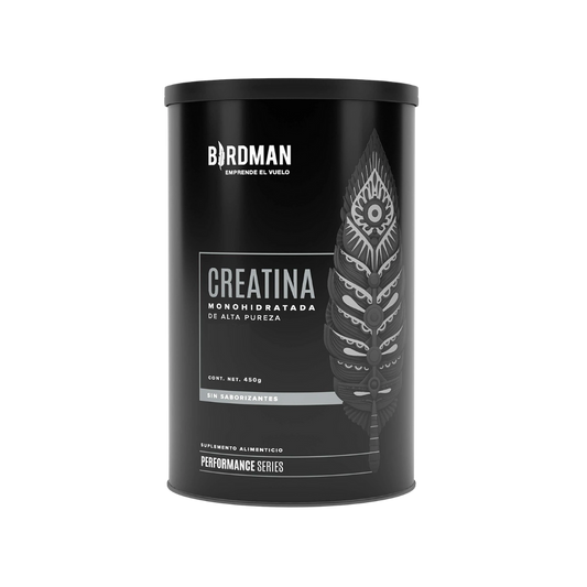 El Getfit Creatina Monohidrato - BIRDMAN cuenta con un envase cilíndrico negro con una pluma estilizada. El texto en español destaca los beneficios para el rendimiento y la masa muscular. La etiqueta de 450 g indica que no contiene aditivos según la Performance Series.