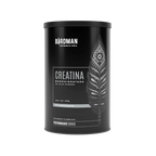 El Getfit Creatina Monohidrato - BIRDMAN cuenta con un envase cilíndrico negro con una pluma estilizada. El texto en español destaca los beneficios para el rendimiento y la masa muscular. La etiqueta de 450 g indica que no contiene aditivos según la Performance Series.